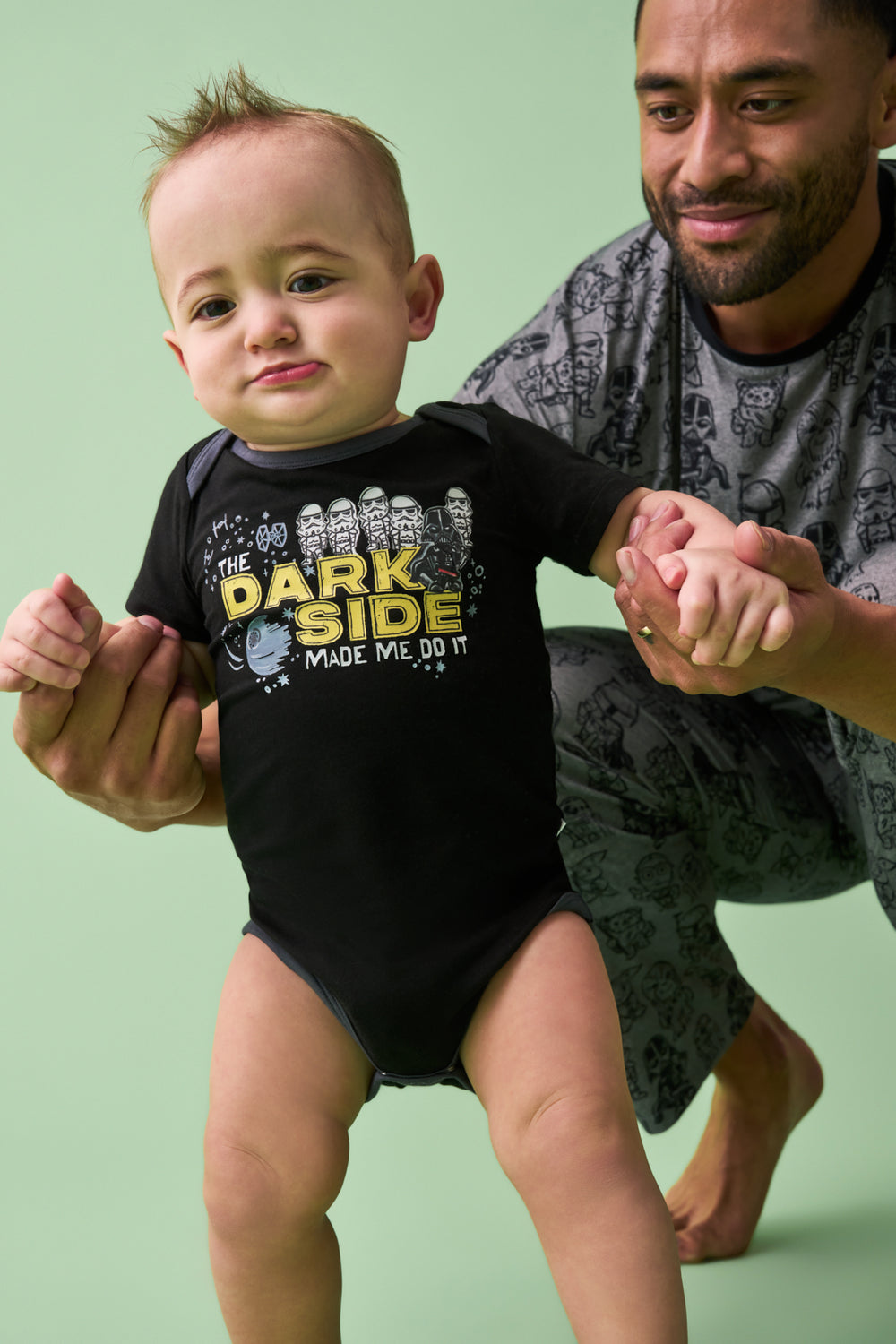 Walking toddler wearing the Star Wars Dark Side Short Sleeve Bodysuit
