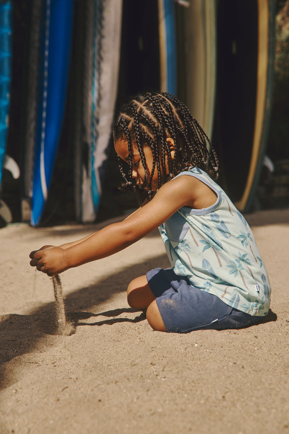 Boy playing with sand in the Palm Dunes Pocket Tank
