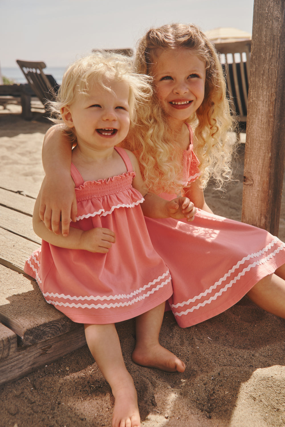 Two girls wearing Coral Play styles at the beach