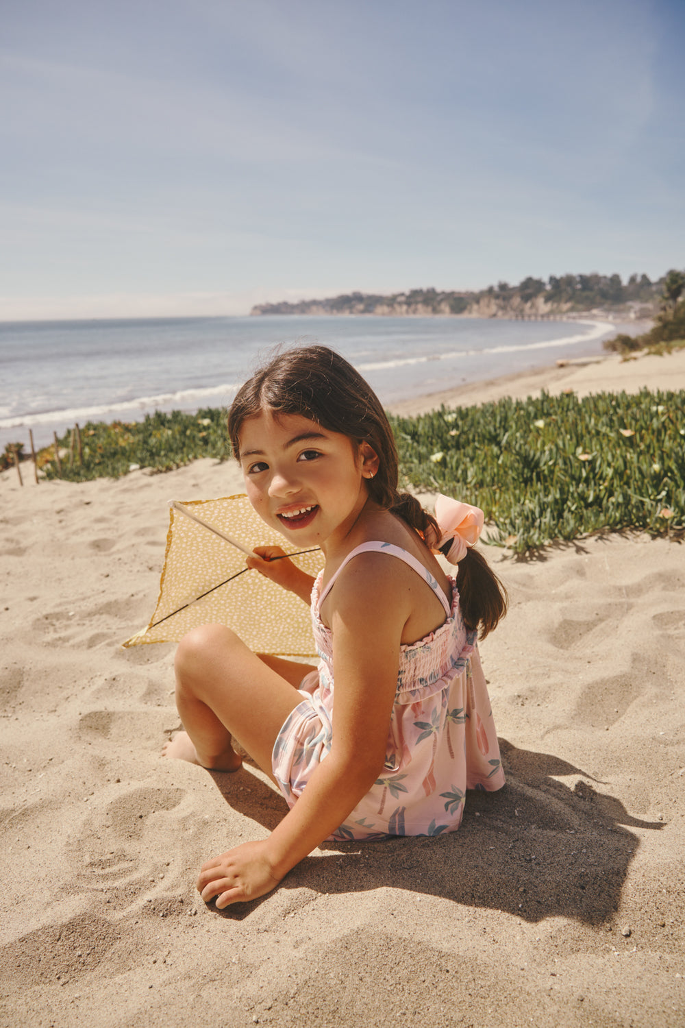 Girl holding a kite wearing the Palm Dunes Smocked Tank & Shorts Set