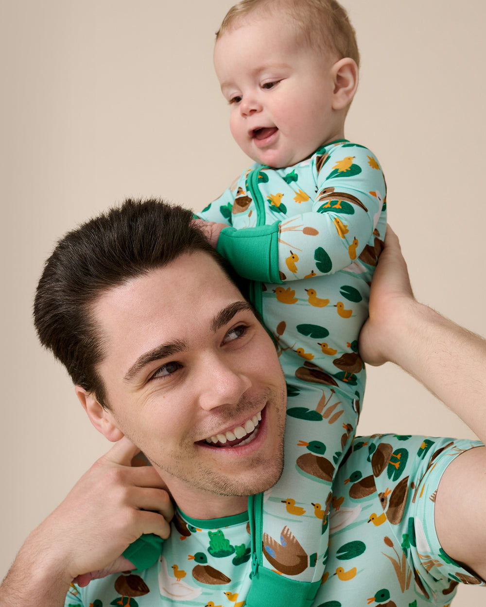 Father and son wearing matching Puddle Jumpers pajamas for Fathers Day
