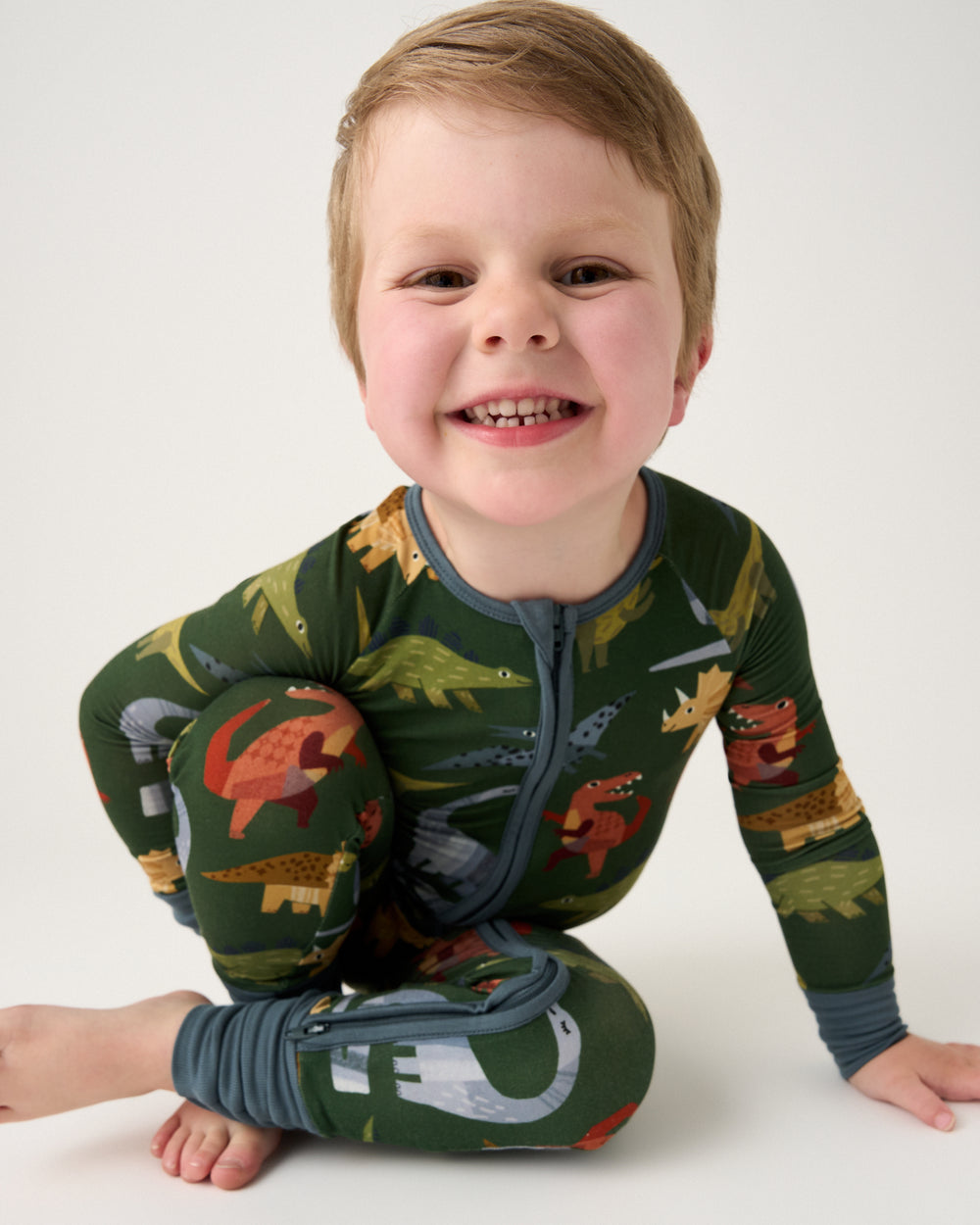 Alternate child wearing the Green Roar & Explore Zippy