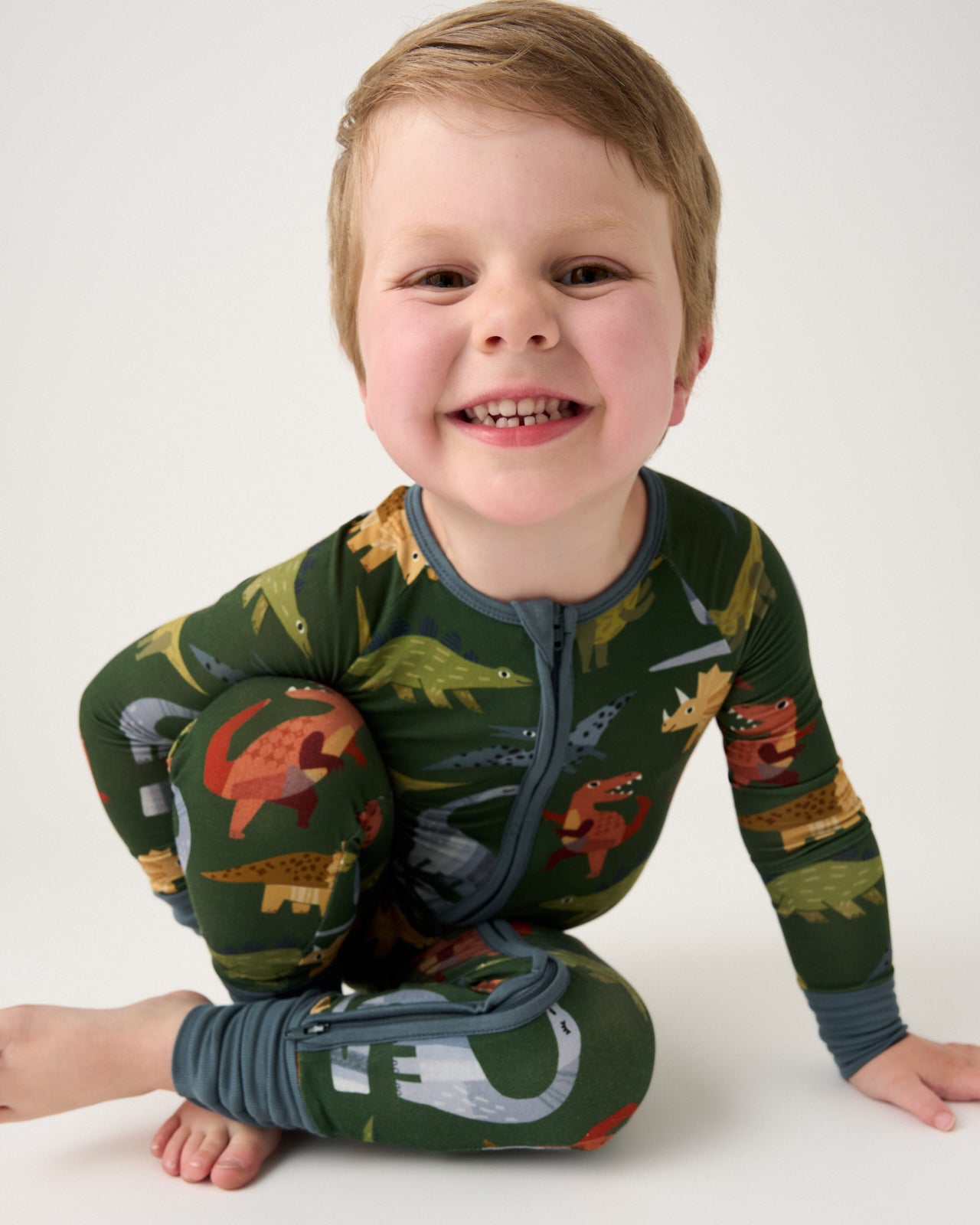 Alternate child wearing the Green Roar & Explore Zippy