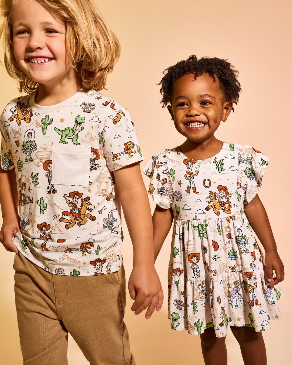 Two children wearing matching Disney & Pixar Woody's Wild West daywear styles