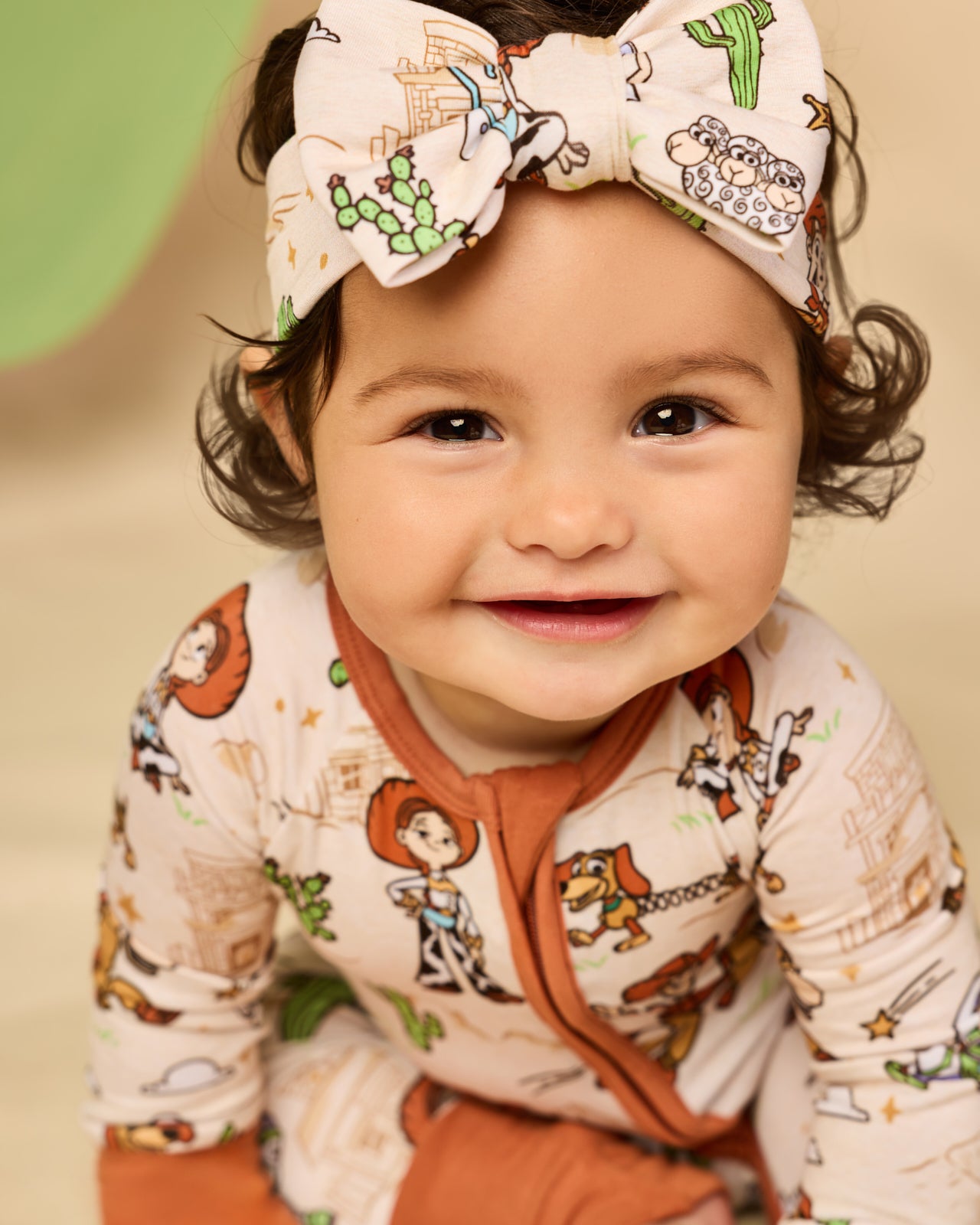 Baby wearing the Disney & Pixar Woody's Wild West Luxe Bow Headband