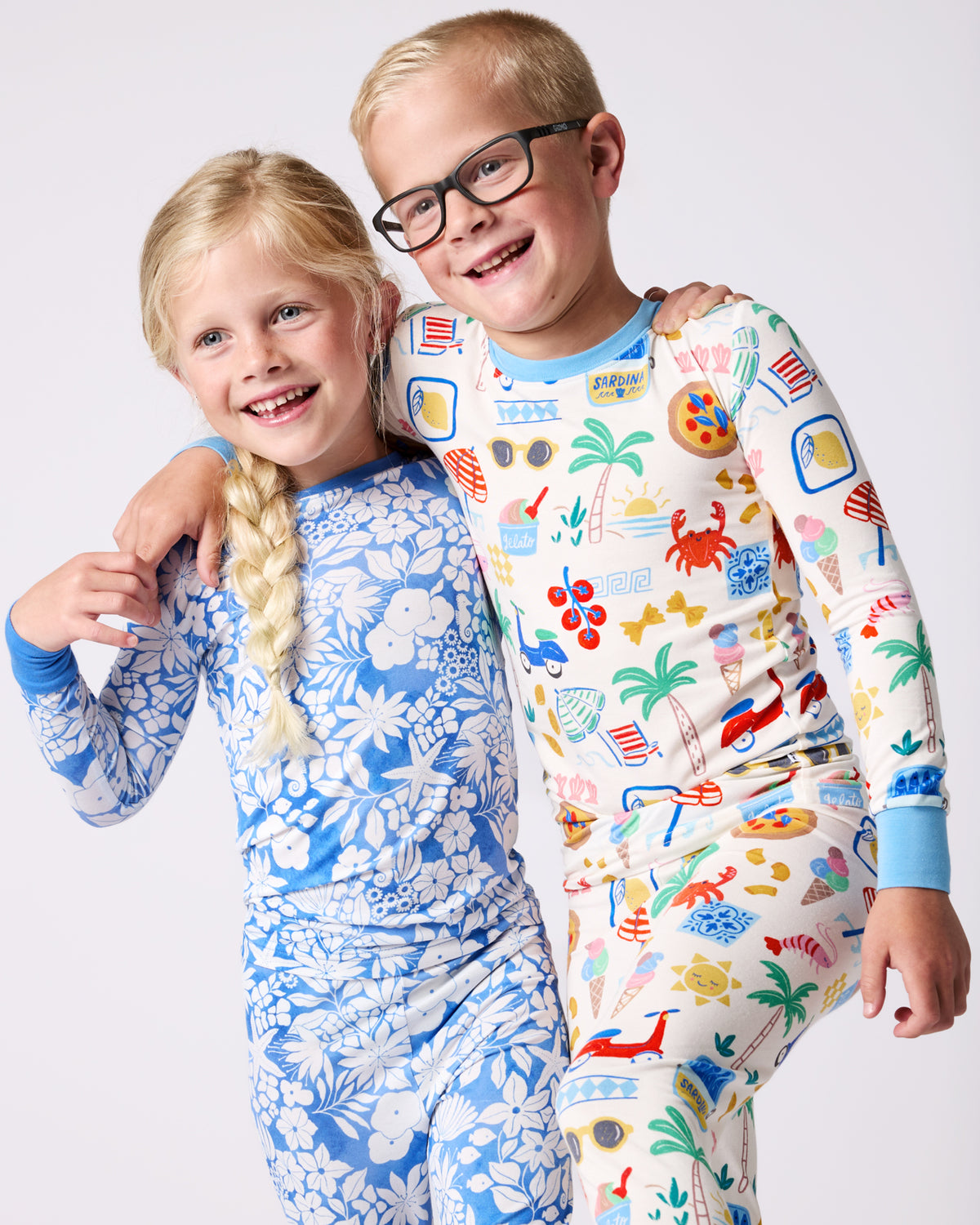 Close up of two children wearing Azure Garden and Ciao Bella Two-Piece Bamboo Pajama Sets