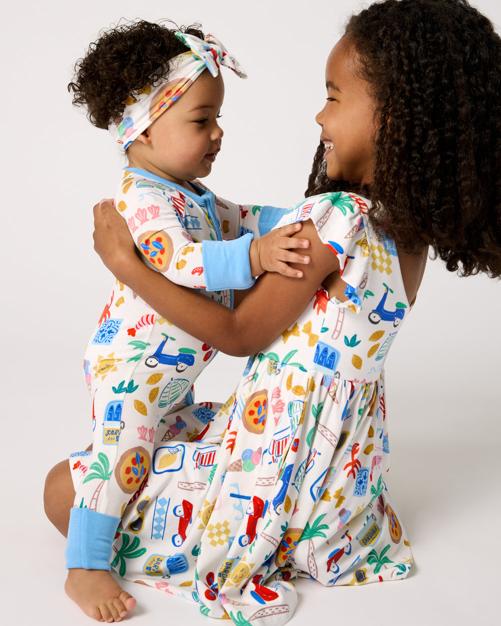 Two kids wearing Ciao Bella styles