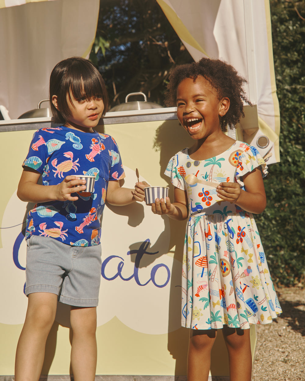 Two children wearing Tidepool Party and Ciao Bella daywear styles 