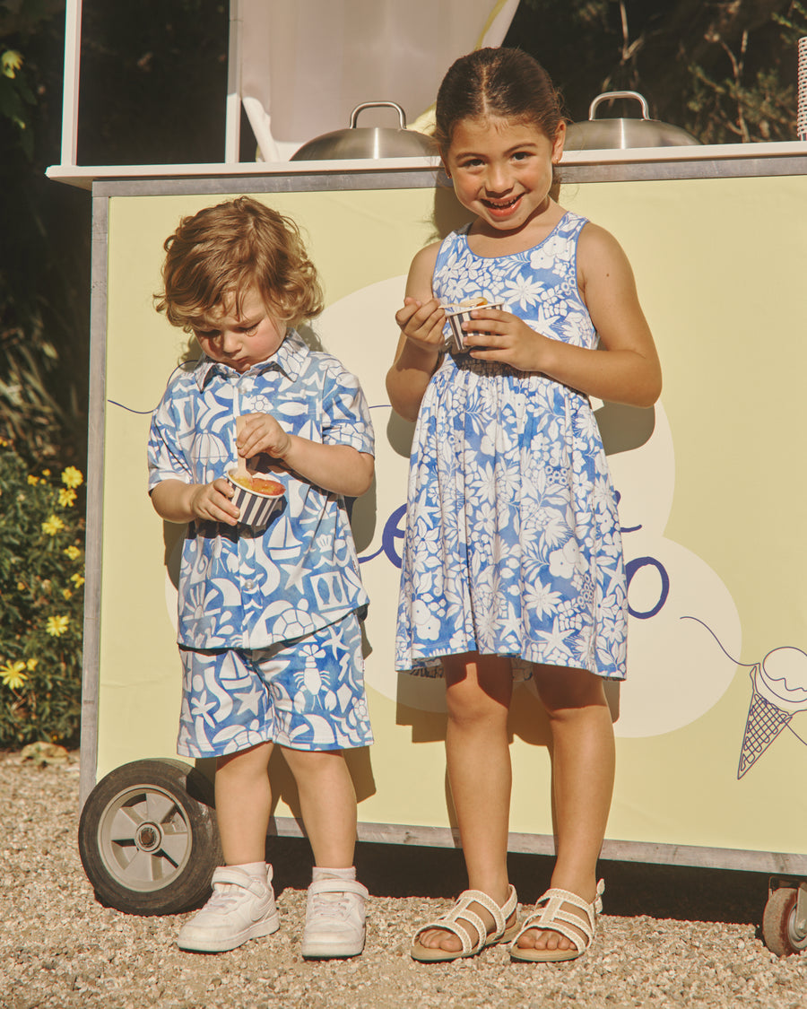 Two children wearing Summer Shores and Azure Garden styles eating gelato
