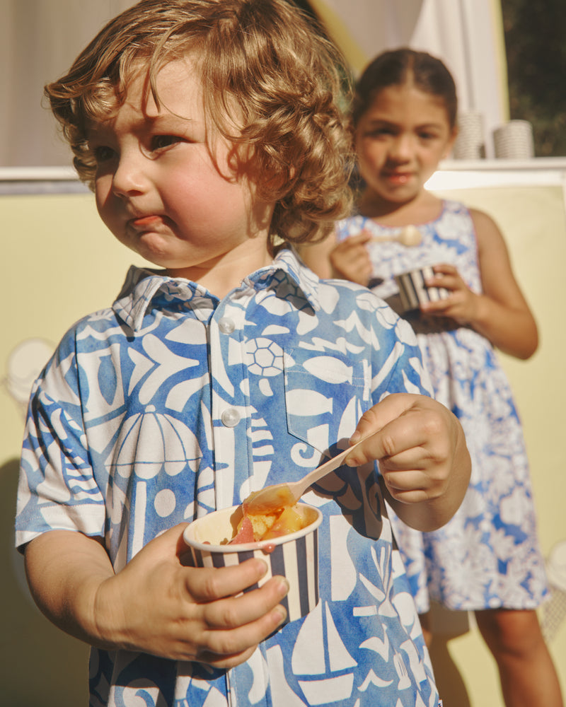 Boy wearing the Summer Shores Button Down Polo eating gelato