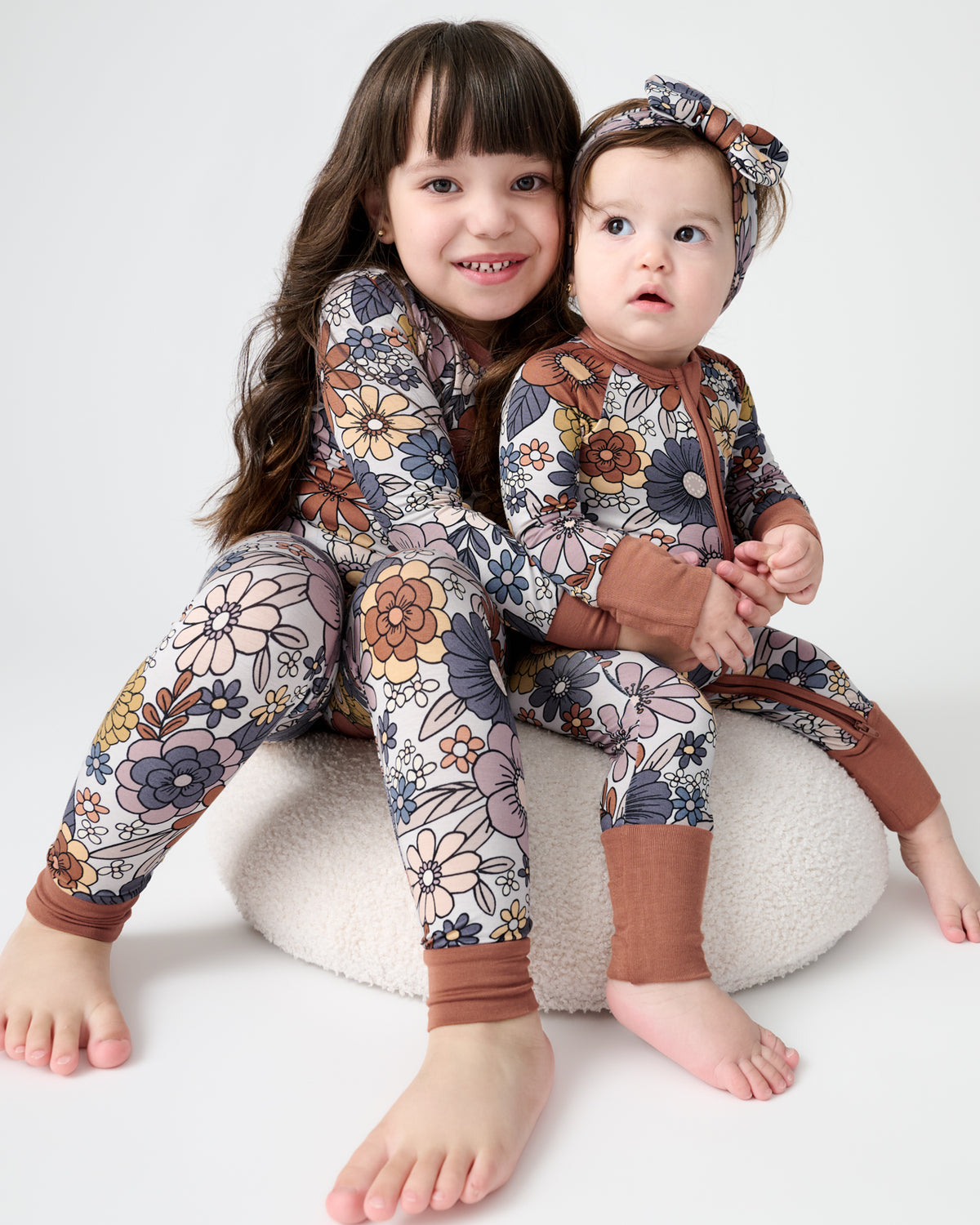 Two children wearing matching Wildwood Floral Pajamas