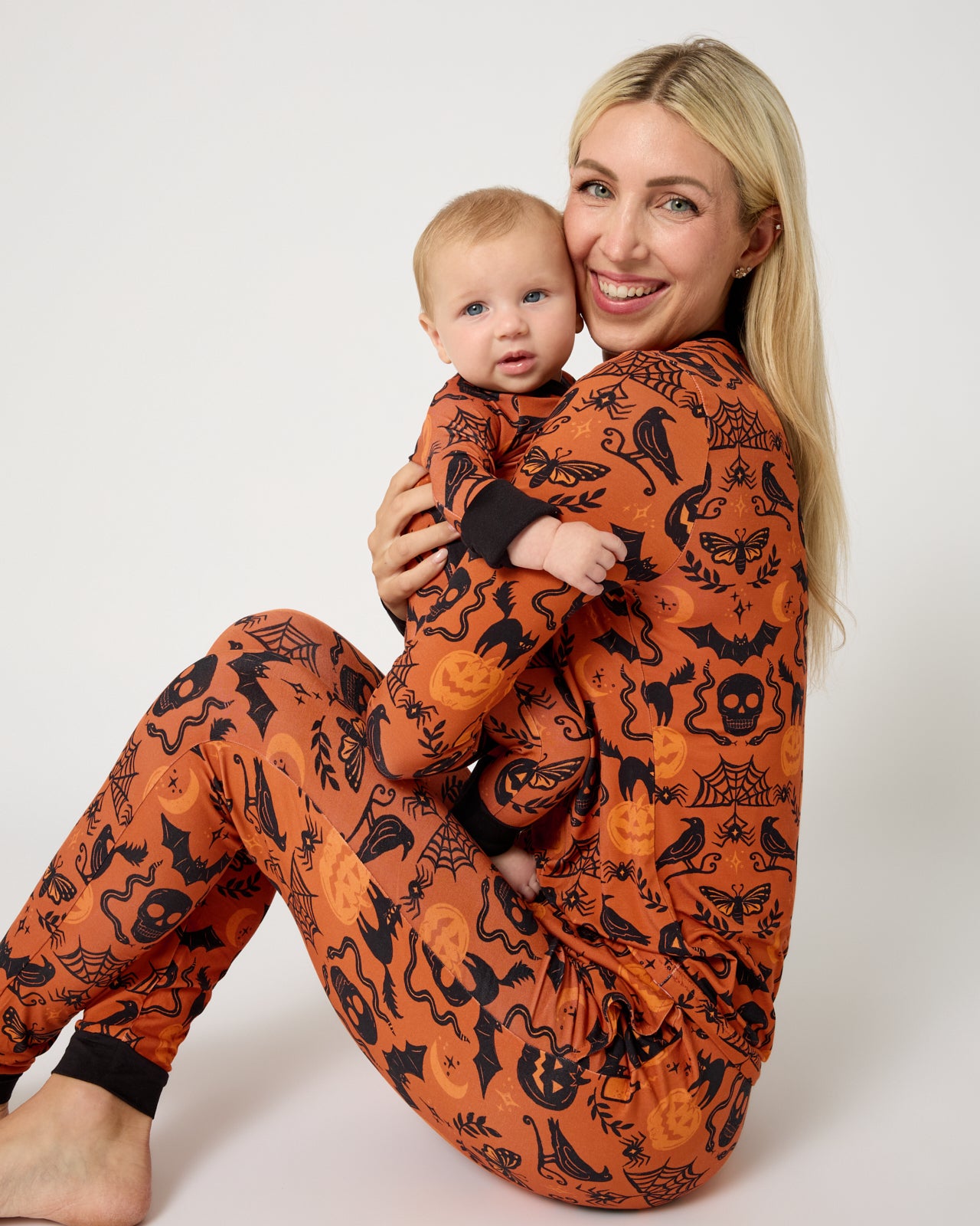 Mother and baby wearing matching Midnight Mischief PJs