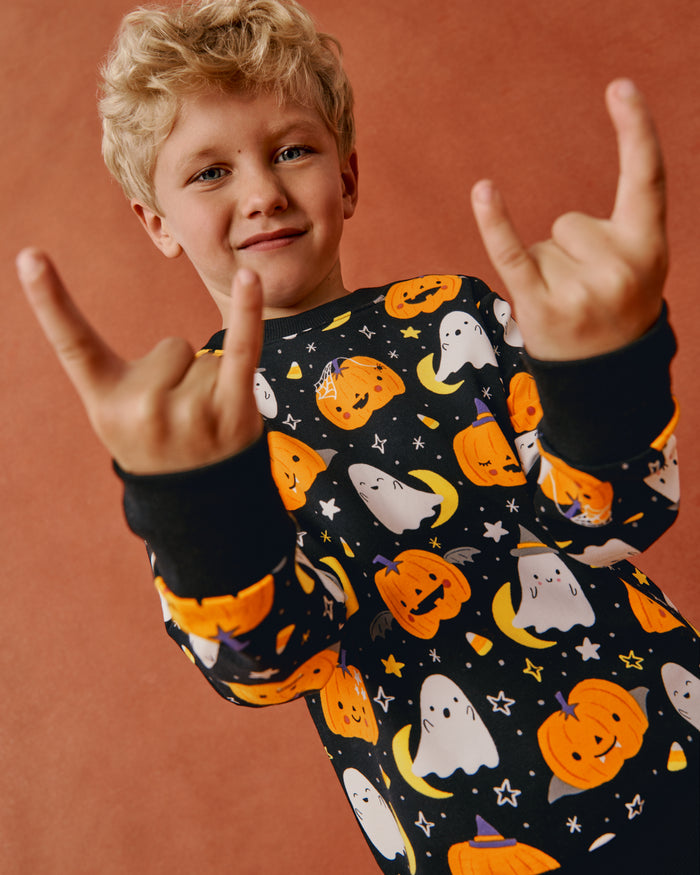 Posing child wearing the Moonlit Magic Crewneck Sweatshirt