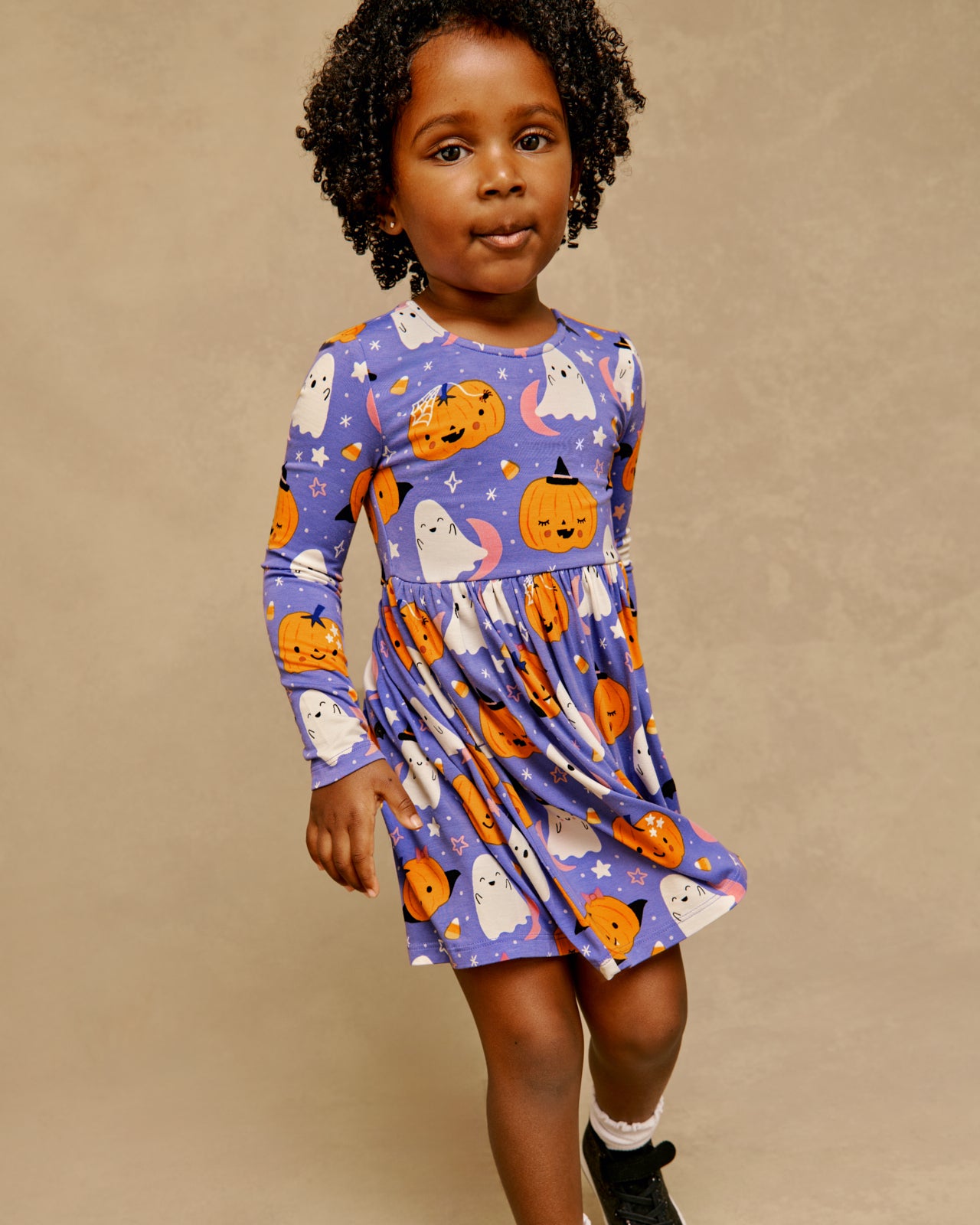 Girl wearing the Moonlit Magic Purple Bow Back Skater Dress