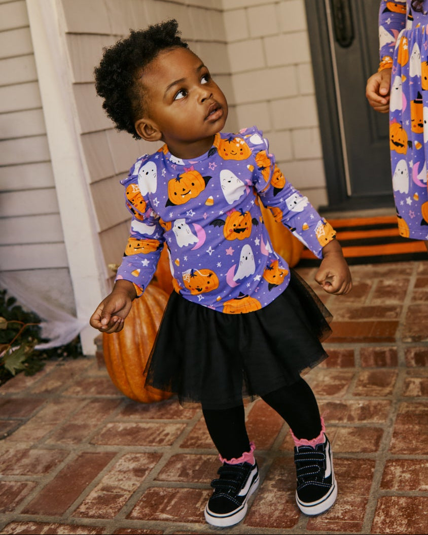 Toddler wearing the Moonlit Magic Purple Flutter Tee with tutu leggings