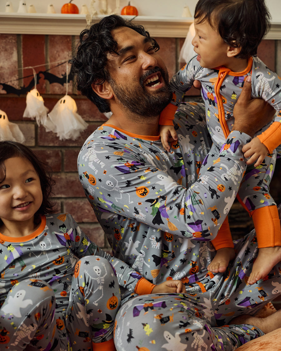 Family of three wearing matching Dracula's Disco Halloween PJs