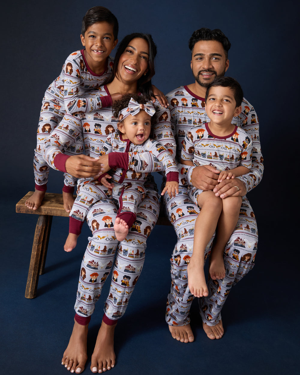 Family of five wearing Harry Potter™ Spellbinding Studies Pajamas