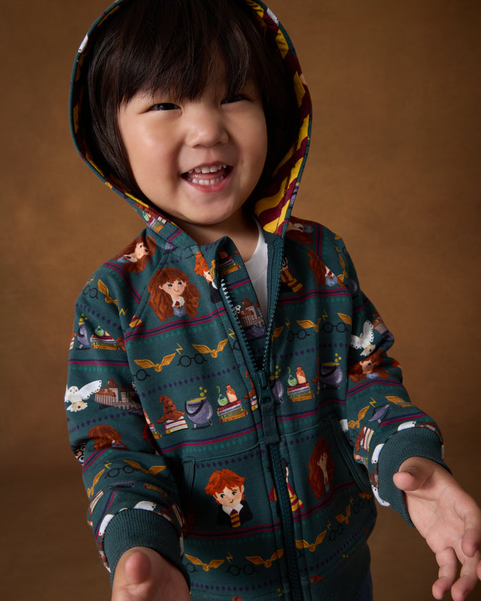 Child wearing the Harry Potter™ Spellbinding Studies Zip Hoodie with the hood on