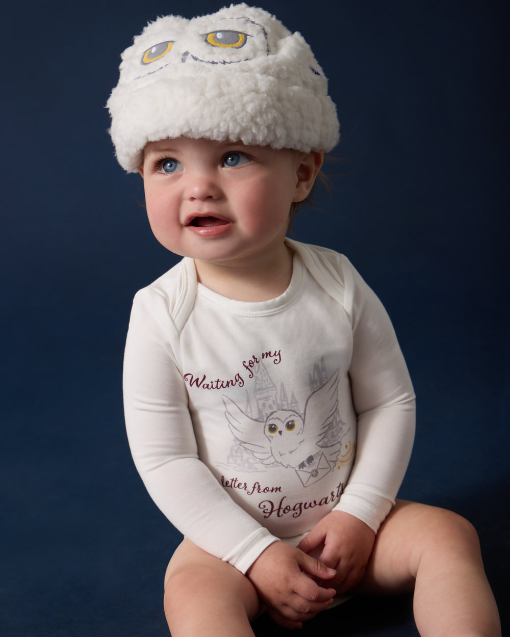 Baby wearing the Harry Potter™ Hedwig Sweater Beanie and Bodysuit
