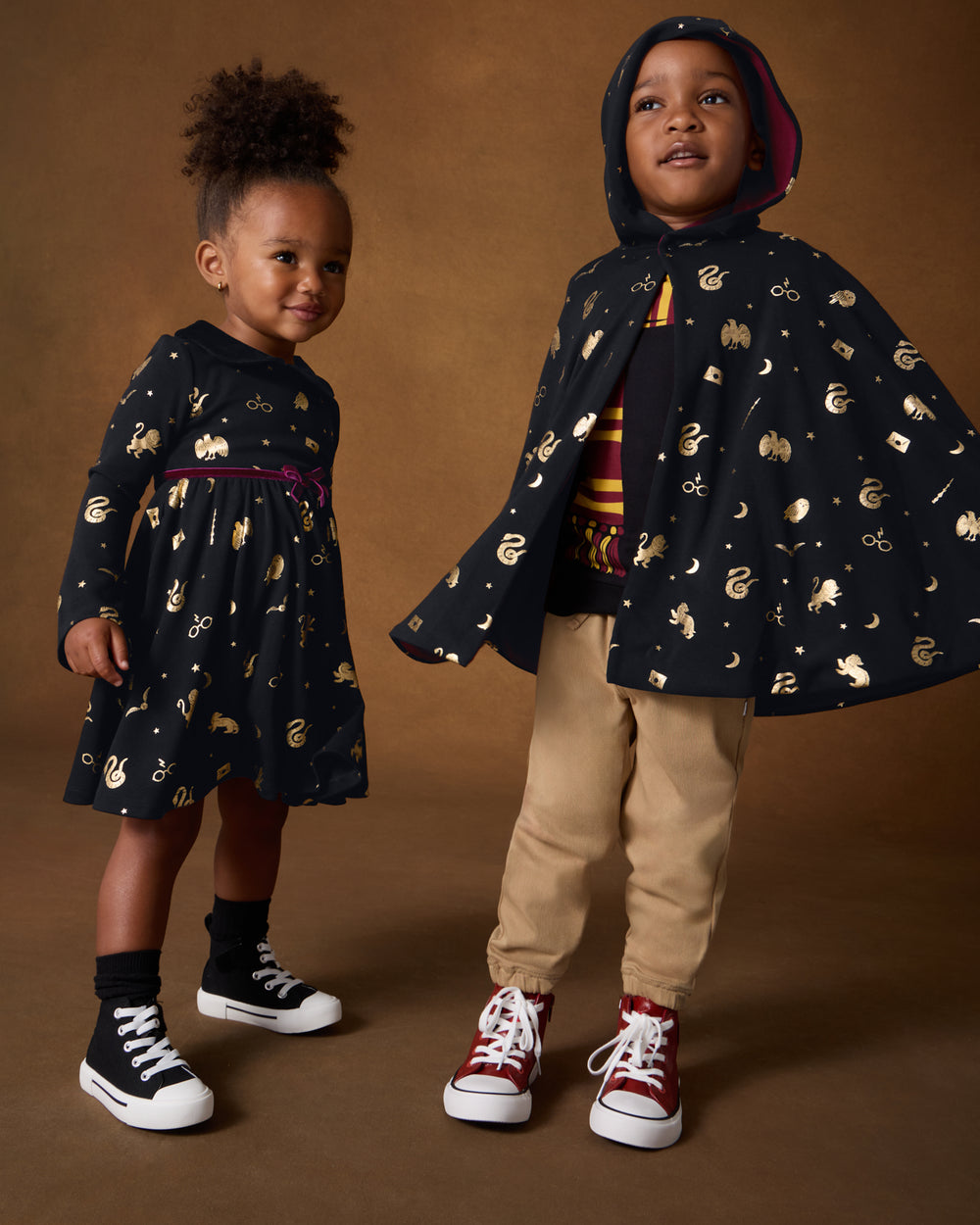 Two children wearing matching Harry Potter™ Spellbinding Studies play styles