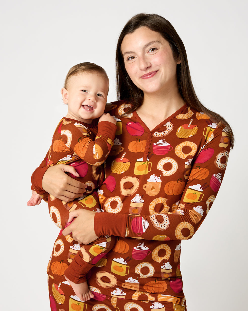 Mother and baby wearing matching Harvest Sweets Autumn pajamas