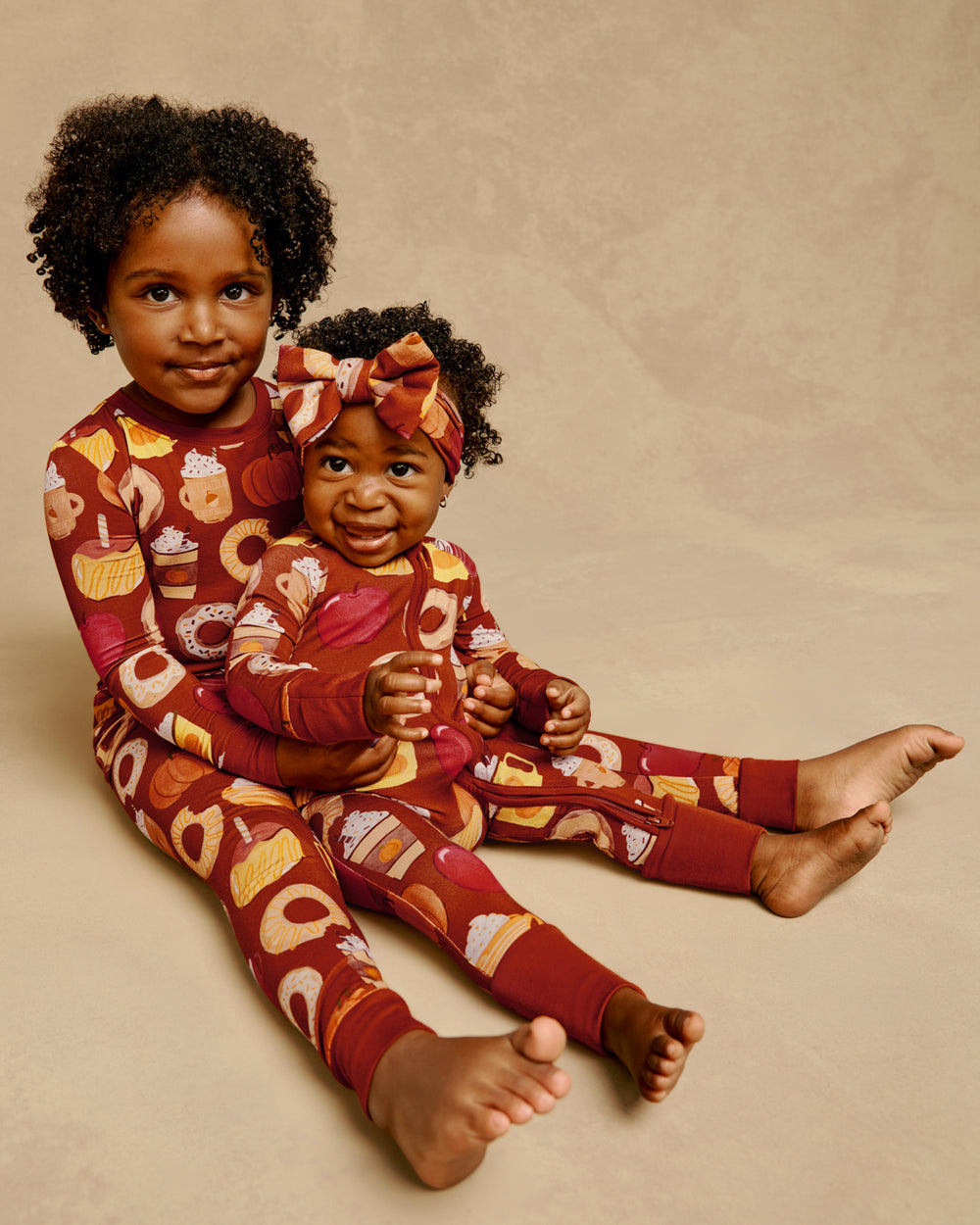 Two children wearing matching Harvest Sweets bamboo pajamas