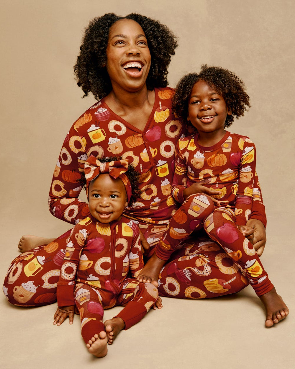 Mother and two children wearing matching Harvest Sweets Fall pajamas