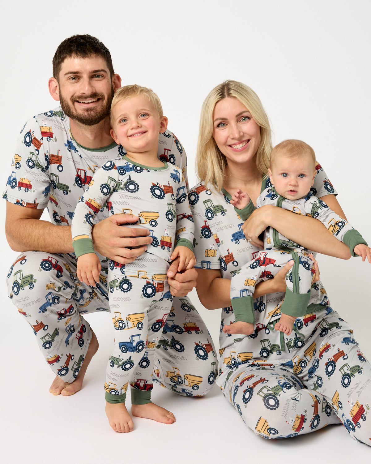 Family of four wearing Tractor Tales bamboo pajamas