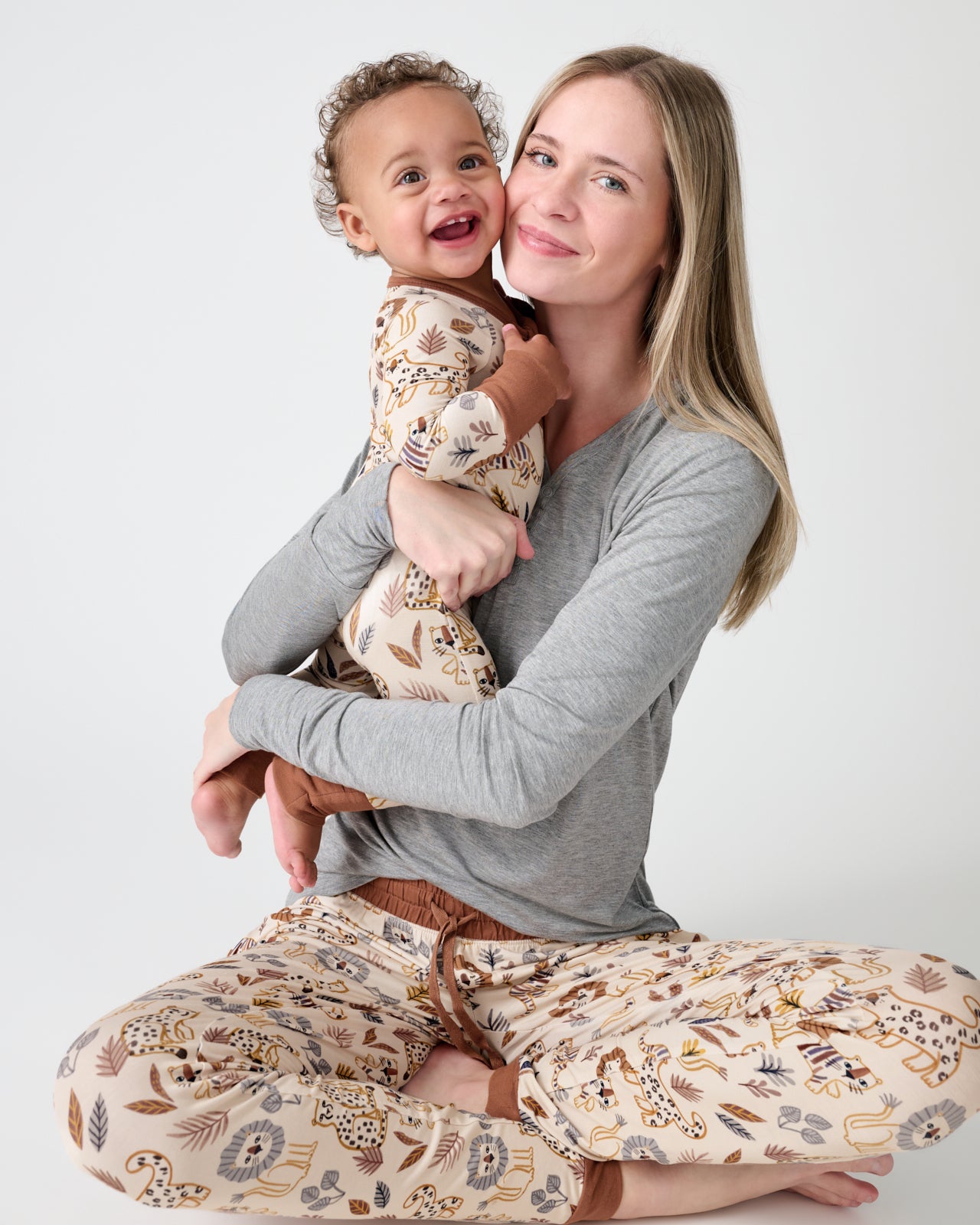 Mother and baby wearing matching Savanna Friends pajamas