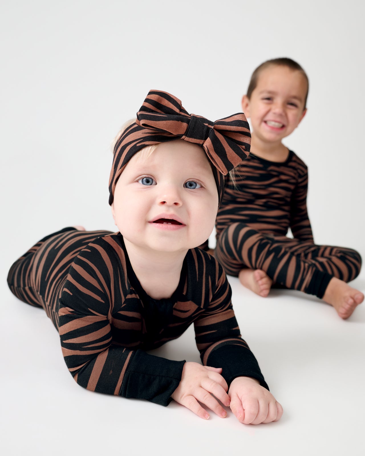 Baby on her tummy wearing the Wild Stripes Luxe Bow Headband