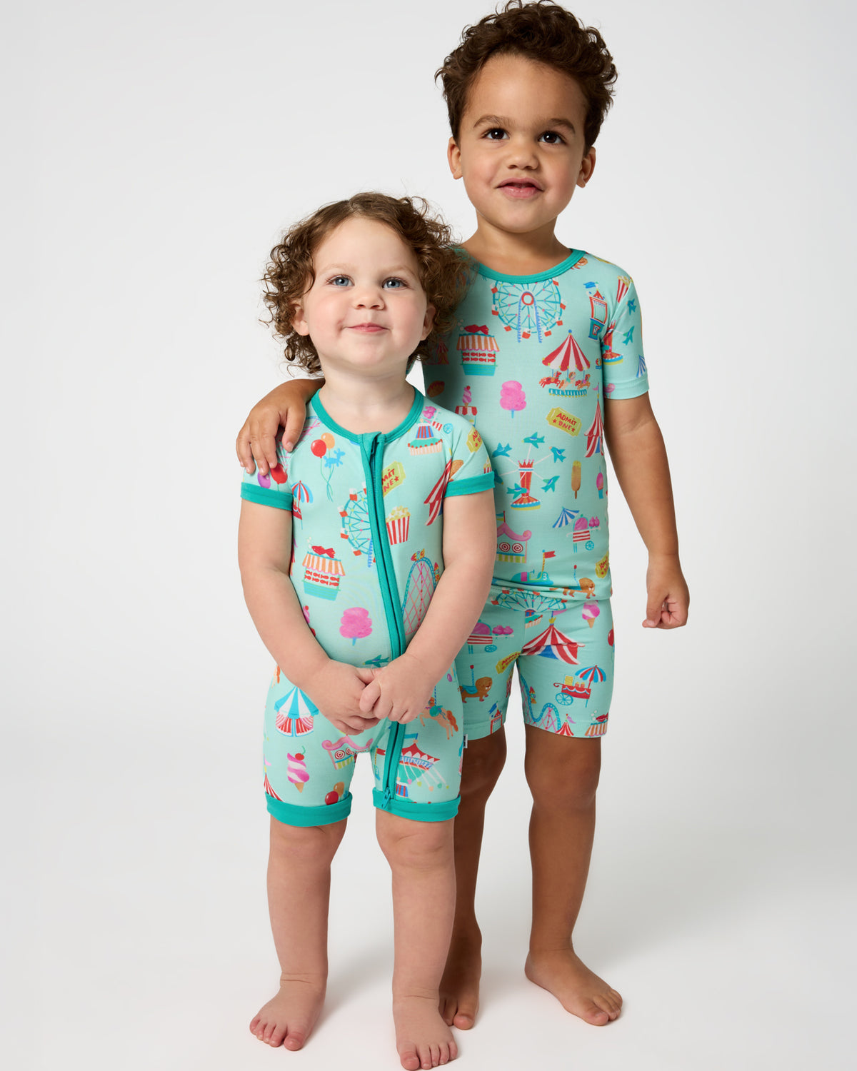 Two children wearing matching Fizzy Fair Pajamas