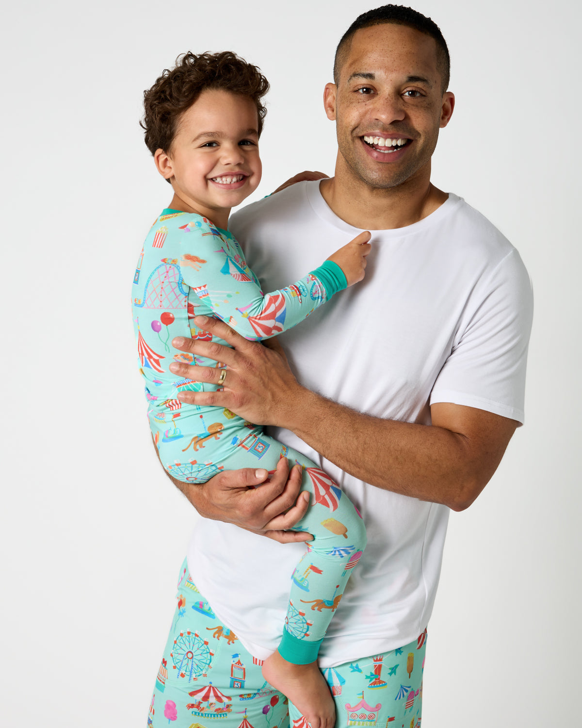 Father and son wearing matching Fizzy Fair Pajamas