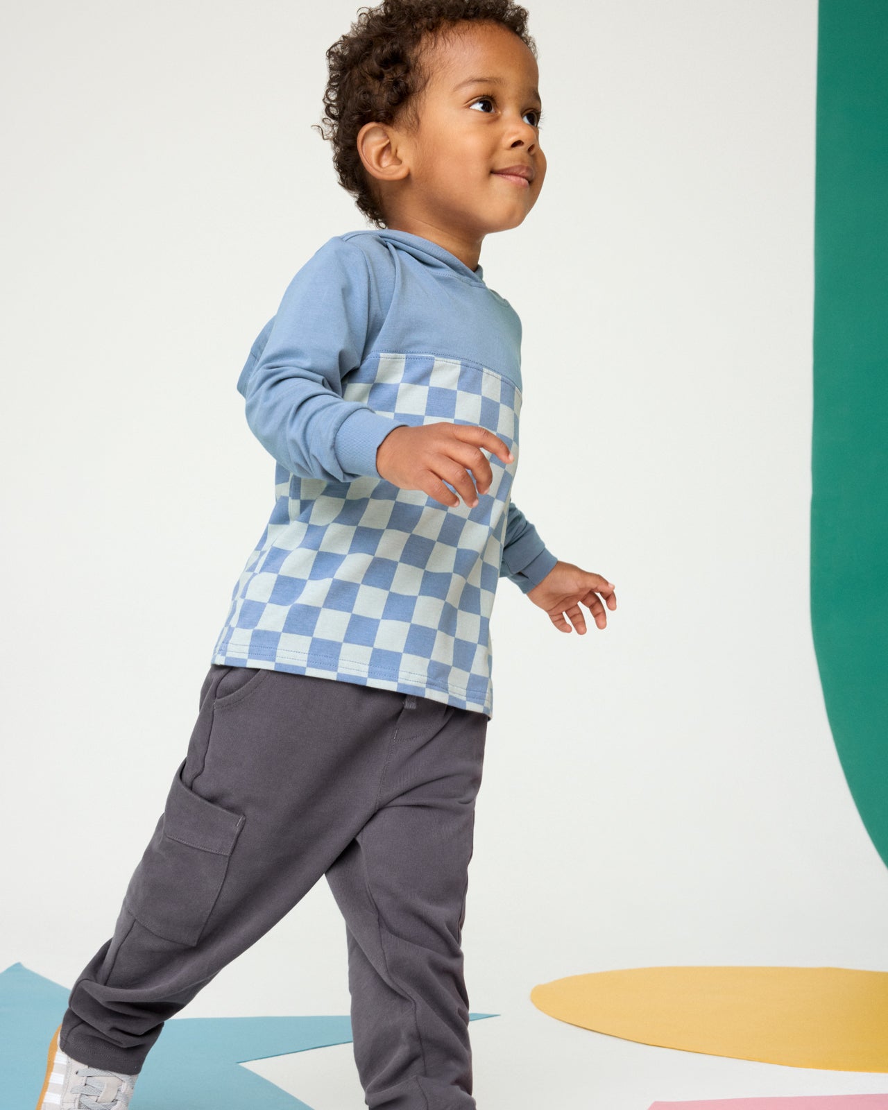 Boy wearing the Dusk Blue Checks Relaxed Hooded Teen with black cargo pants