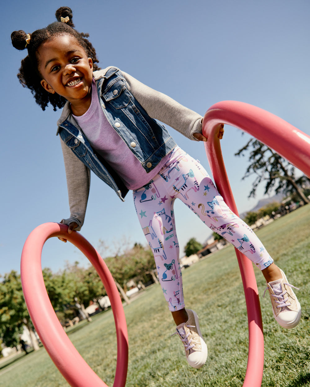 Girl wearing the Whiskers & Wags Purple Legging on a playground