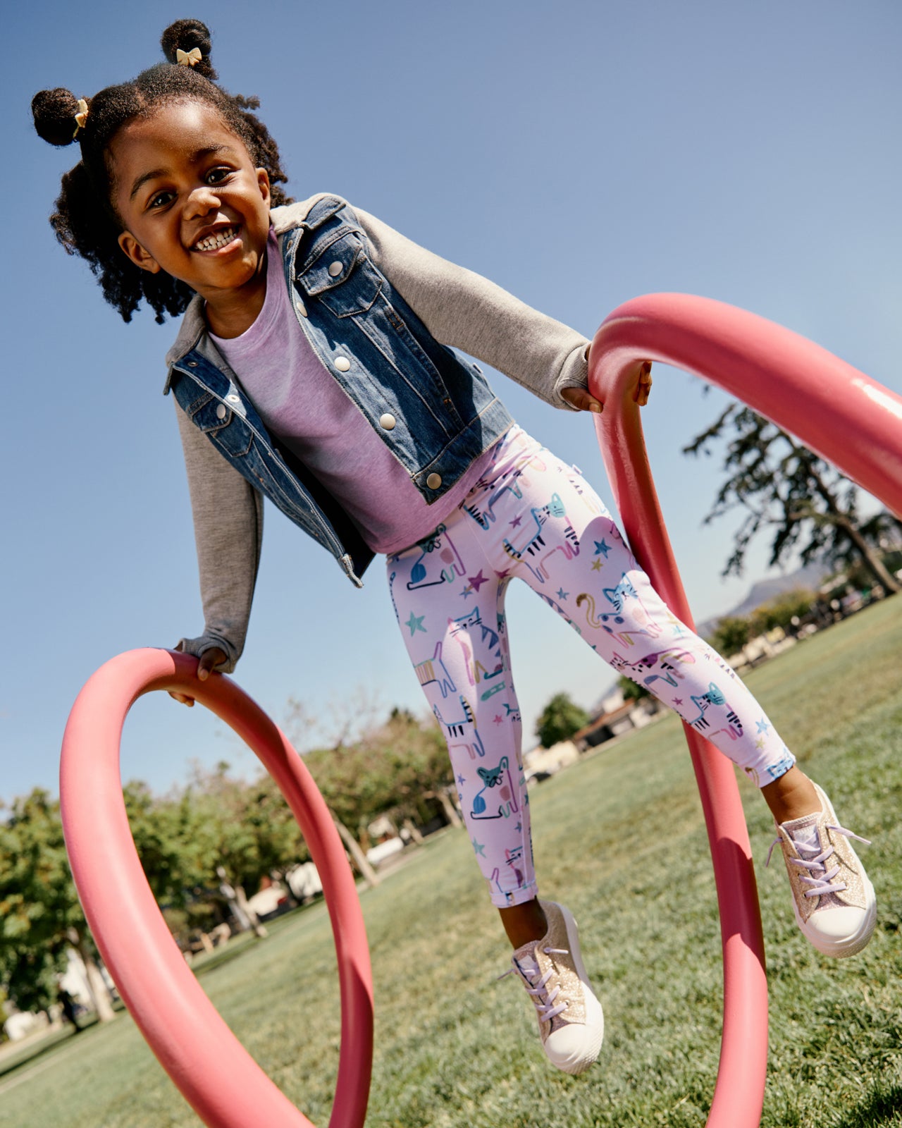 Girl wearing the Whiskers & Wags Purple Legging on a playground