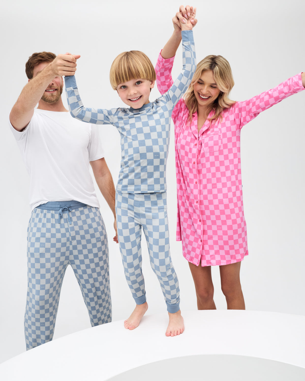 Family of three wearing Sweet Raspberry and Dusk Blue Checks Pajamas