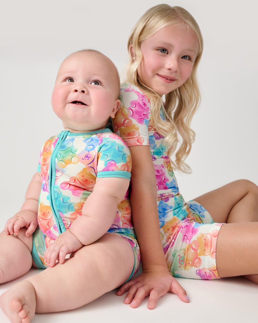 Two children wearing matching Gummy Giggles PJs