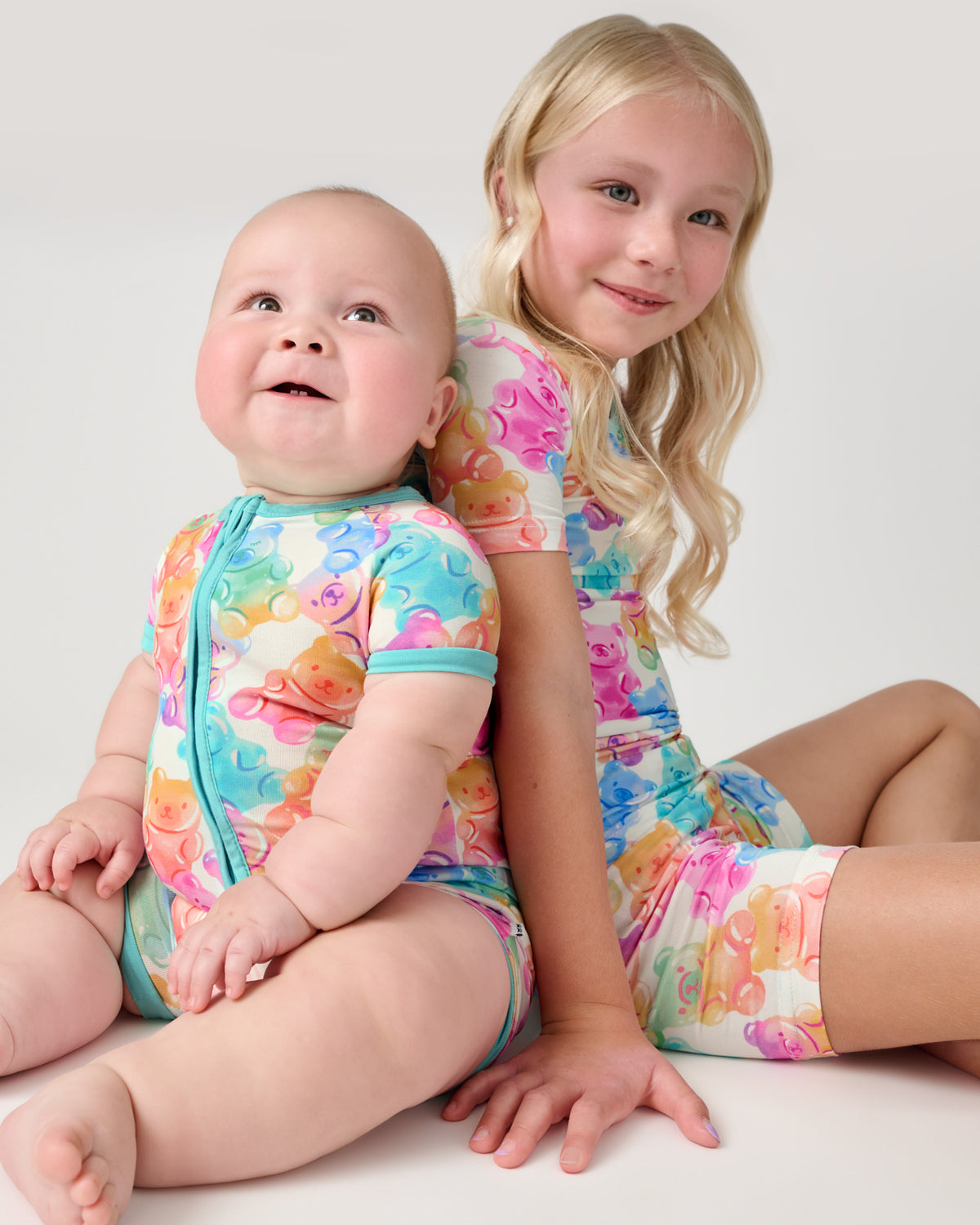 Two children wearing matching Gummy Giggles PJs