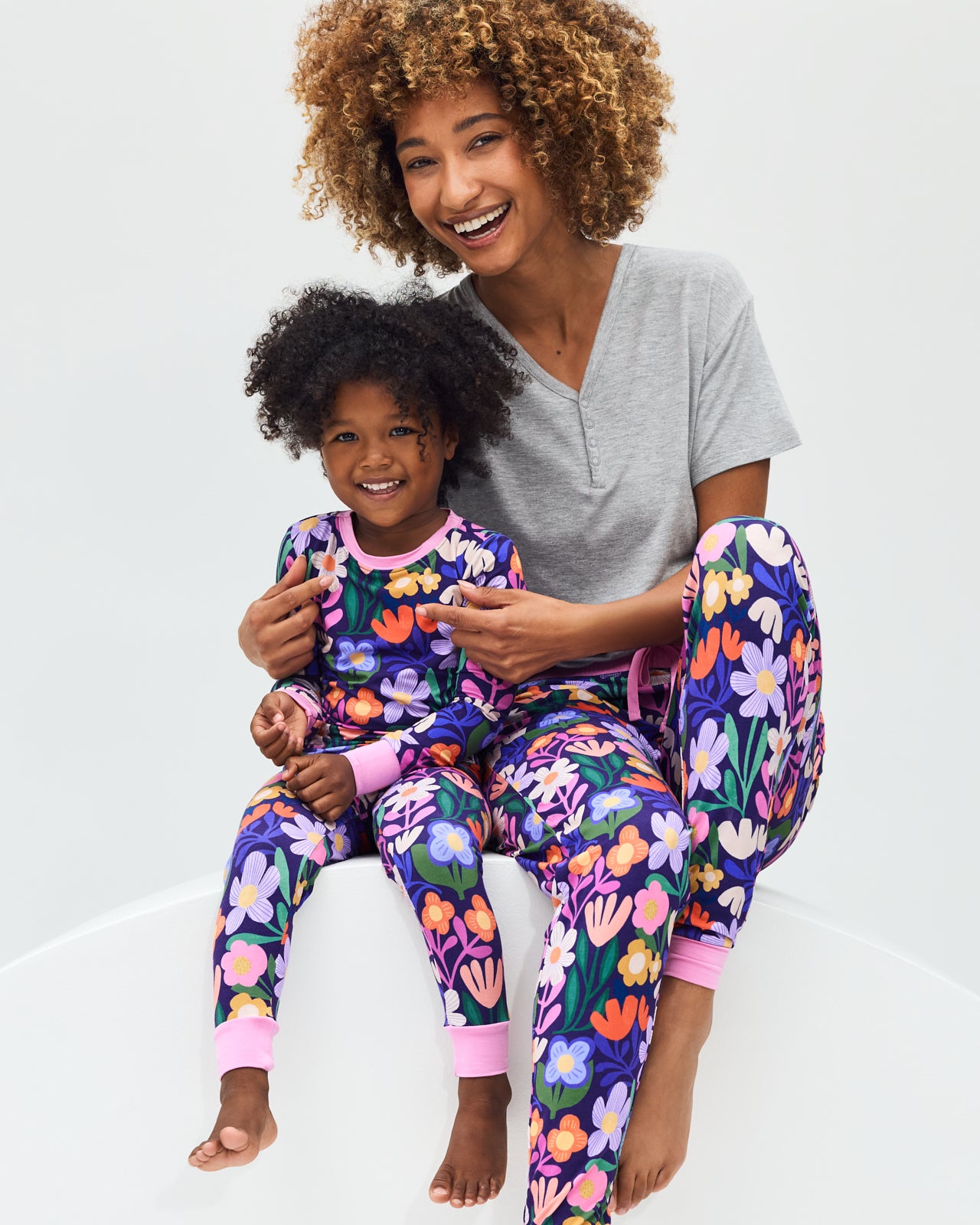 Mother and daughter wearing matching Wild Garden pajamas
