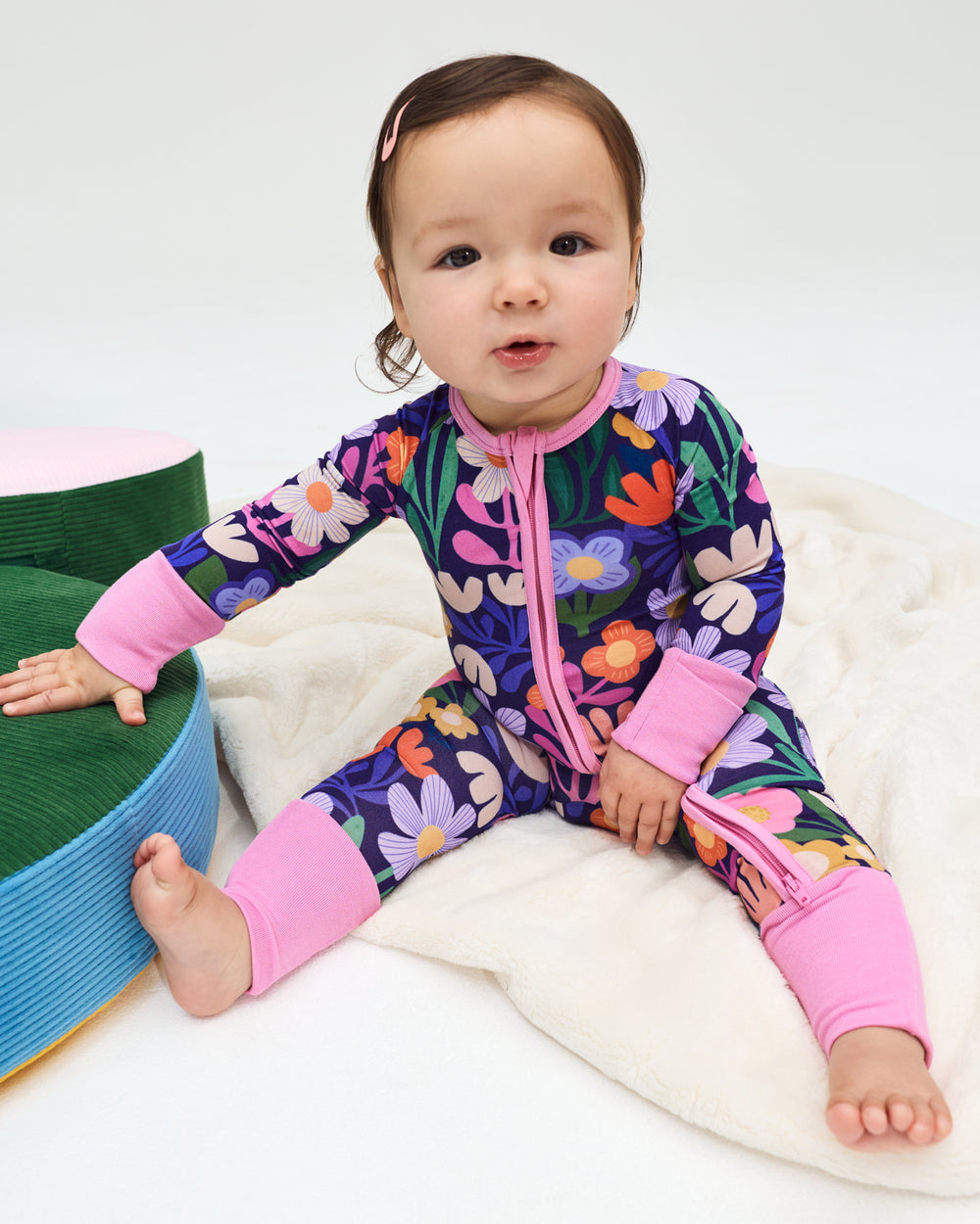 Sitting baby wearing the Wild Garden Zippy