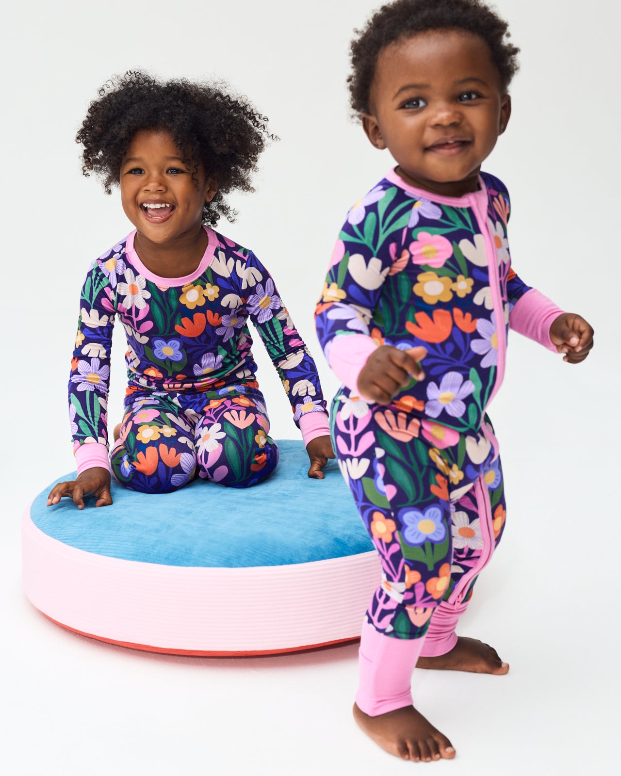 Two children wearing matching Wild Garden Floral Pajamas