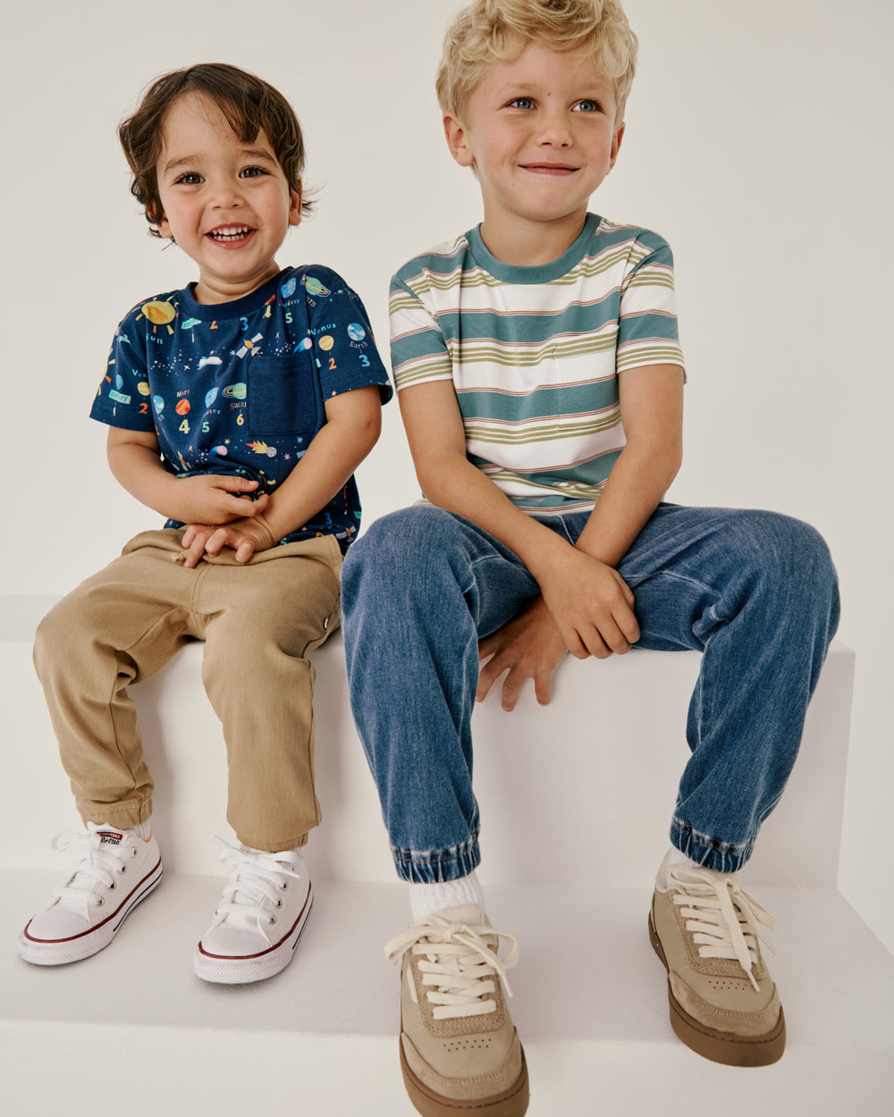 Two boys wearing shirts from The Tee Shop