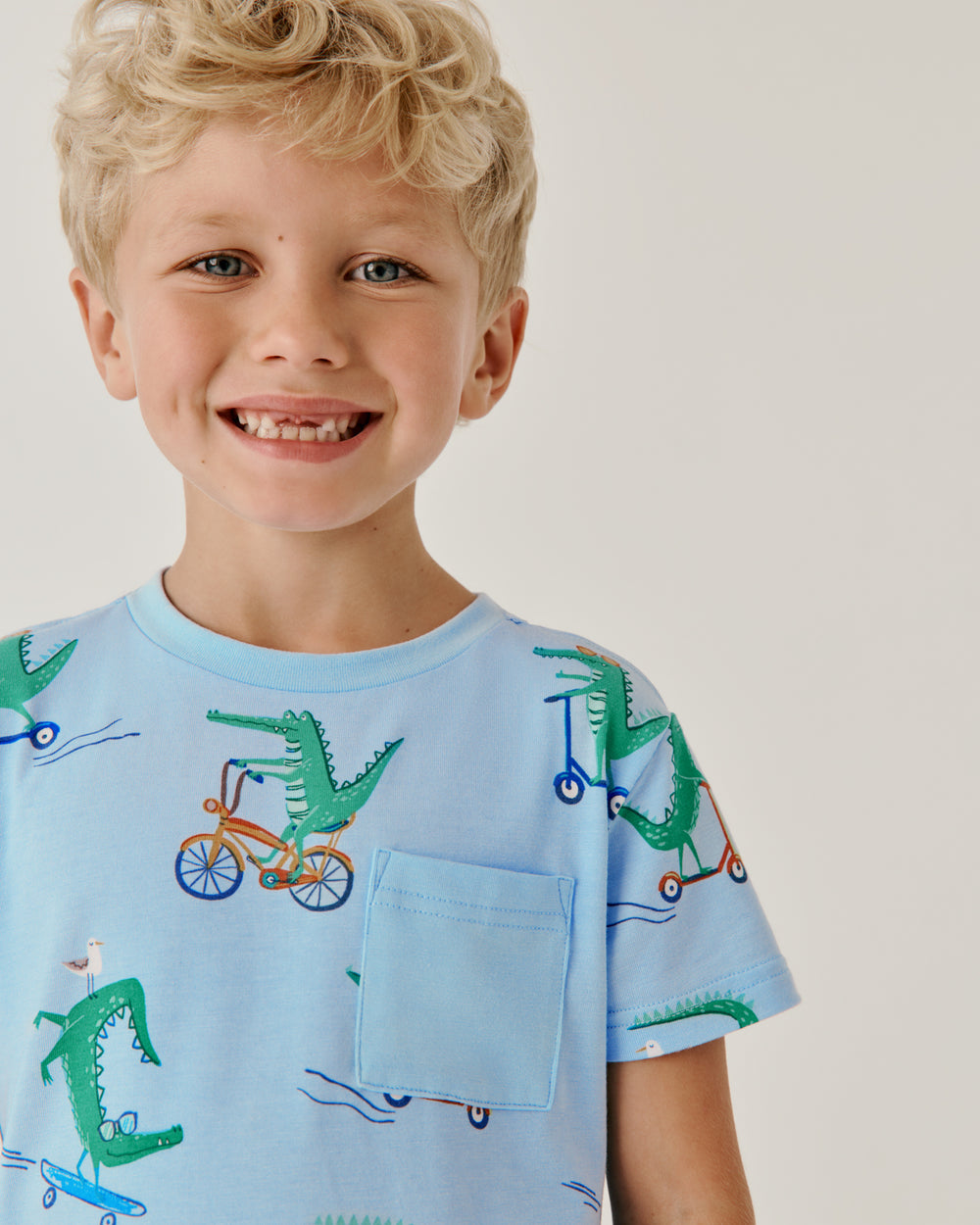 Close up of boy wearing the Lator Gator Relaxed Pocket Tee