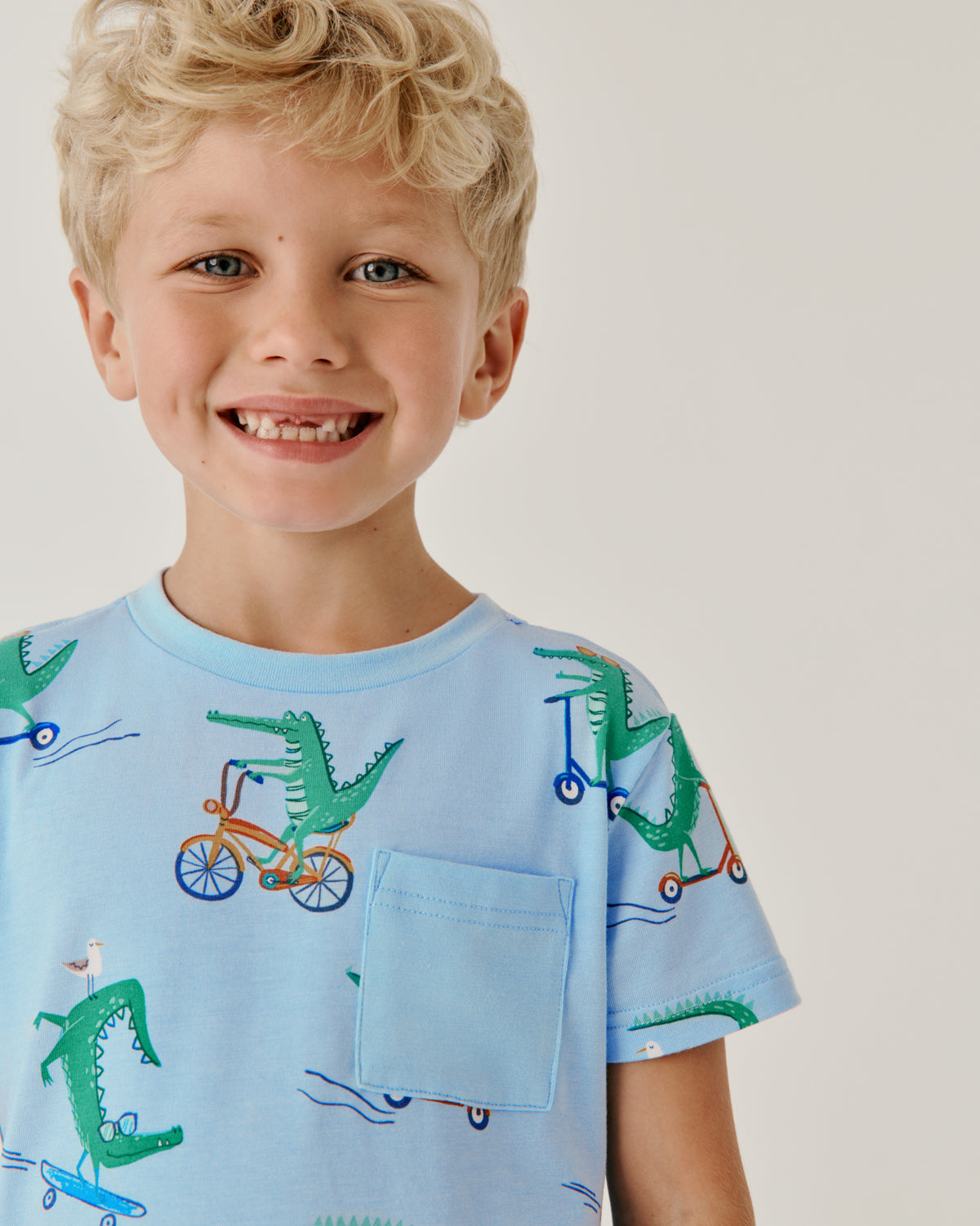 Close up of boy wearing the Lator Gator Relaxed Pocket Tee