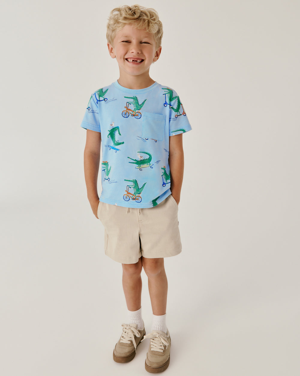 Boy wearing the Lator Gator Relaxed Pocket Tee with khaki shorts