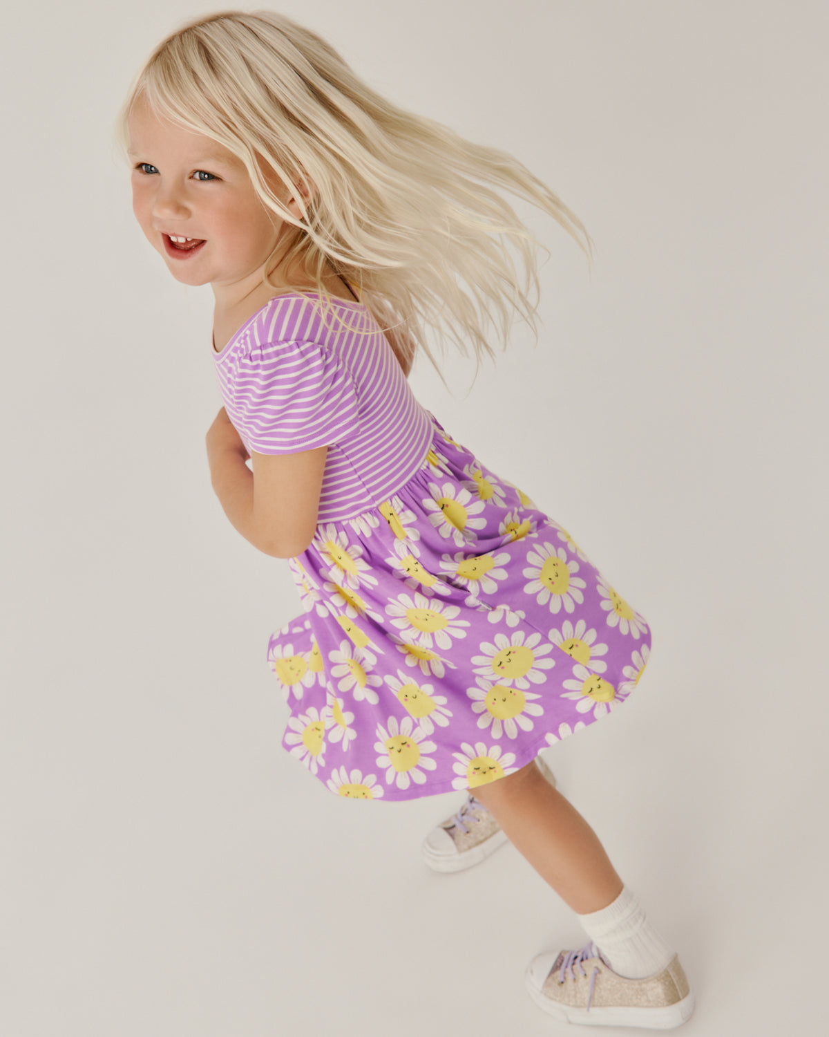 Child in motion wearing the Flower Power Skater Dress
