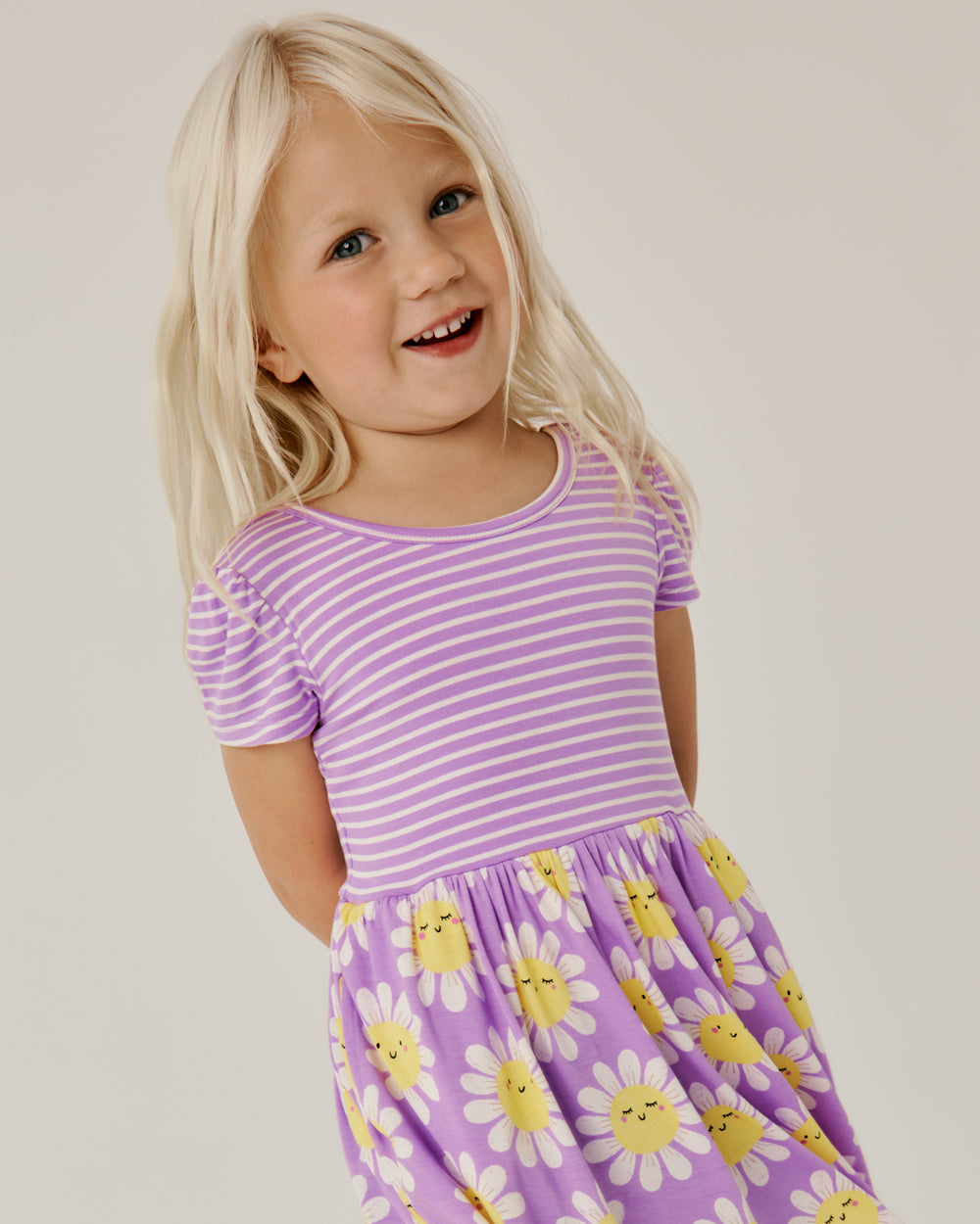 Close up of girl wearing the Flower Power Skater Dress