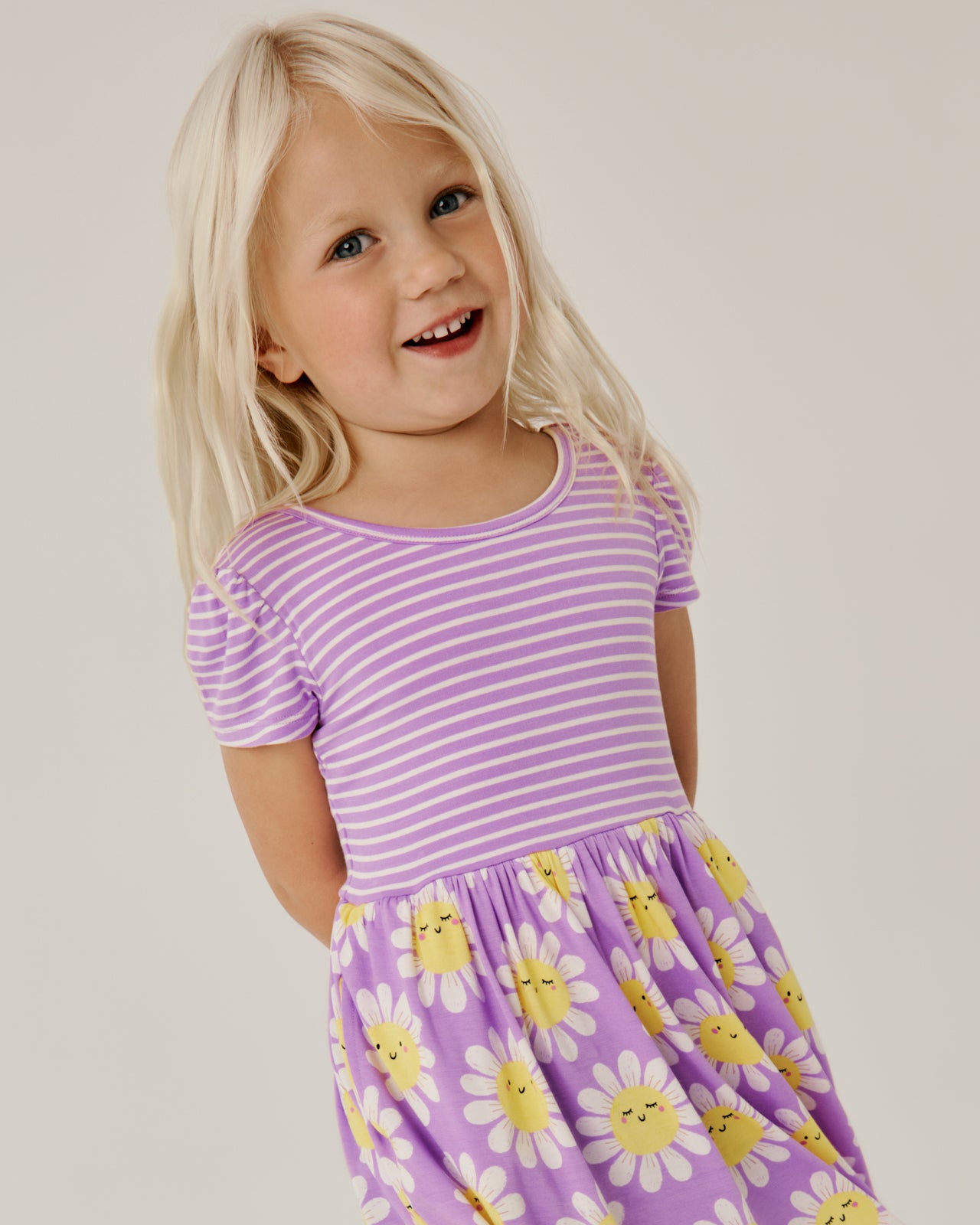 Close up of girl wearing the Flower Power Skater Dress