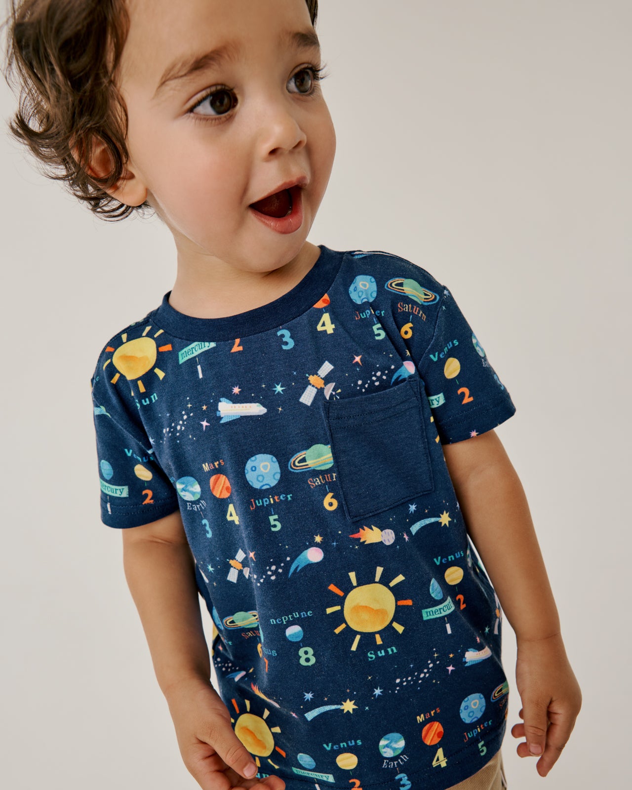 Boy wearing the Solar Explorers Relaxed Pocket Tee