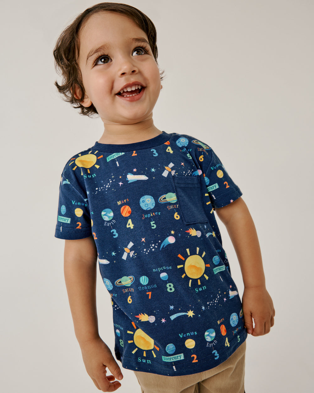 Boy wearing the Solar Explorers Relaxed Pocket Tee with khaki pants